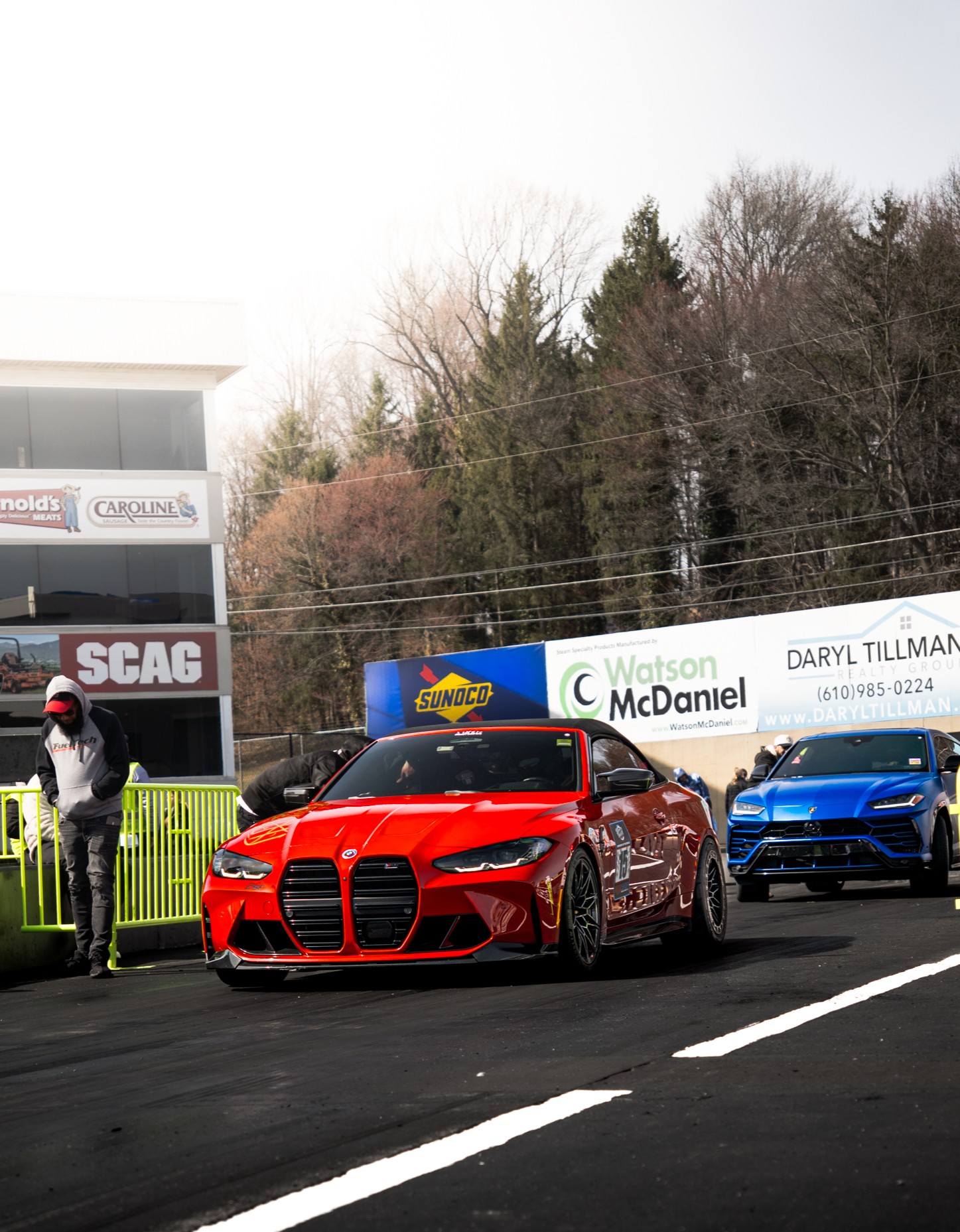 Car racing on track with motion blur and dynamic composition in motorsports photography setting